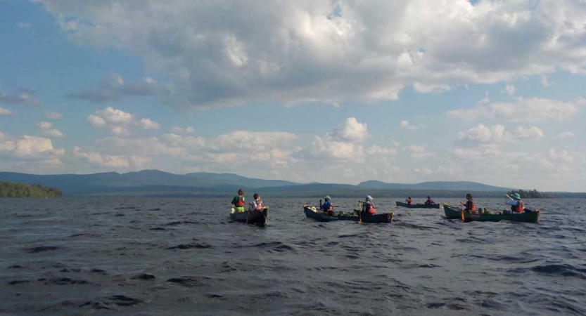 teens on group canoeing course